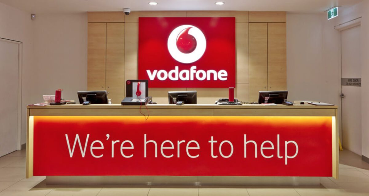 The Vodafone customer service desk with bold branding and a welcoming, well-lit design.